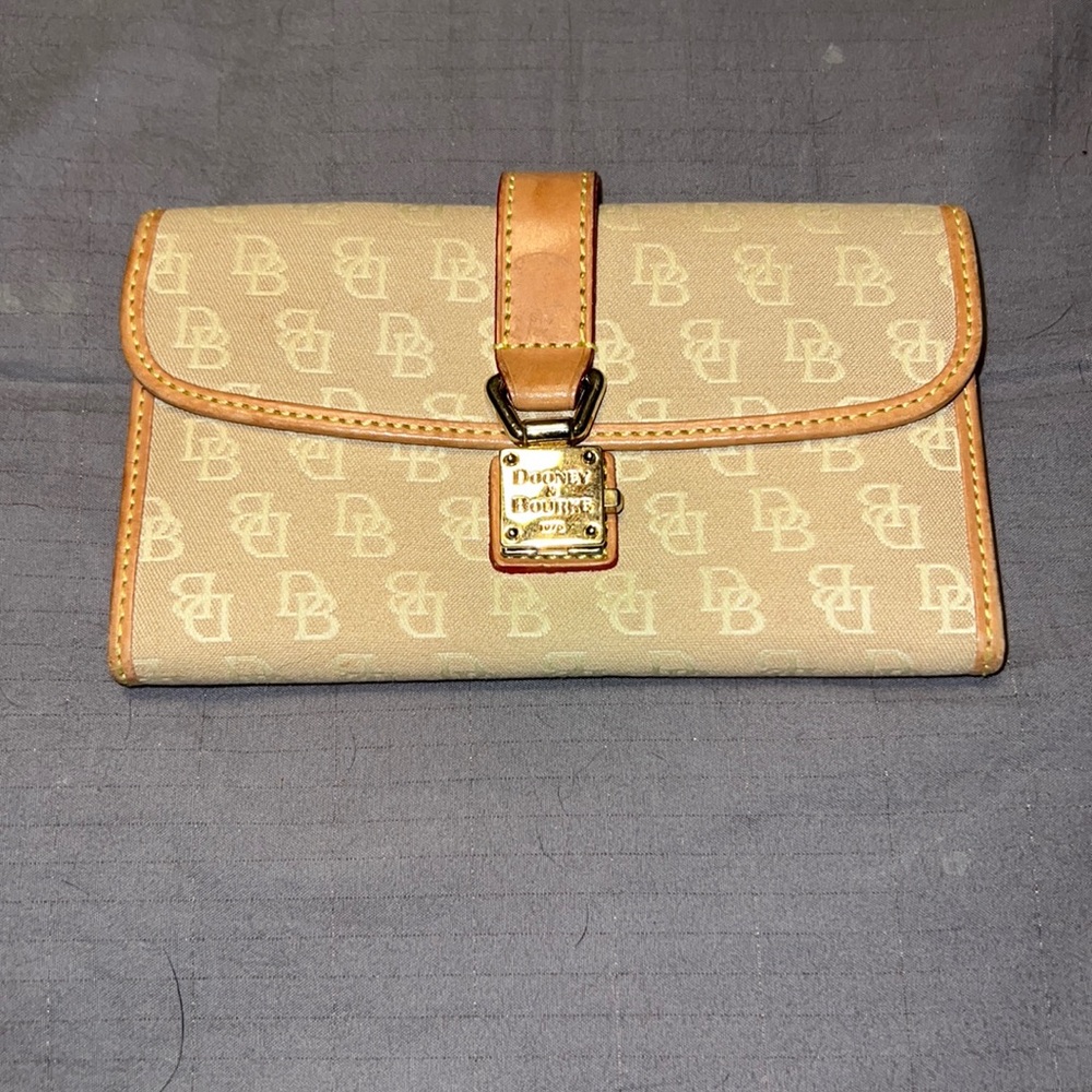Dooney & Bourke spring lock and fold out wallet.